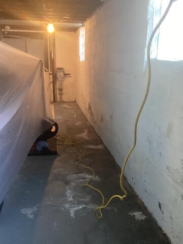Damp and Damaged Basement Waterproofed in Buffalo, NY - Before Photo