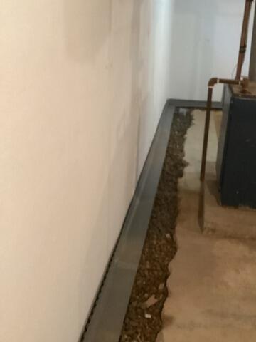 New Perimeter Drainage System Implemented in Newfane, NY Basement