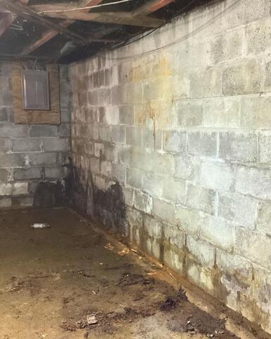 Water Seepage Struggles in a Springville, NY Basement Solved - Before Photo