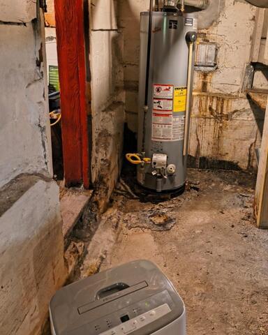 Dehumidifier Upgrade to Stop Damp Feeling and Smell in Mumford, NY - Before Photo