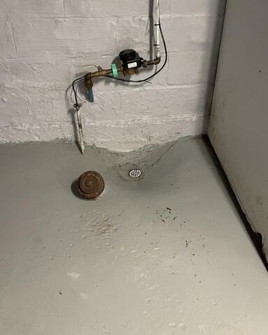 Floor Drain Replaced for a Super New Sump Pump in Rochester, NY - Before Photo