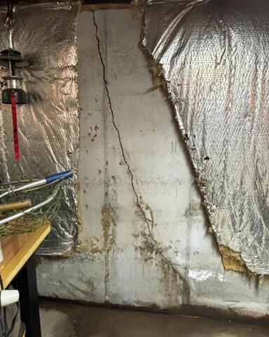 A Newfane, NY Basement With a Severe Leaking Wall Crack Repaired - Before Photo