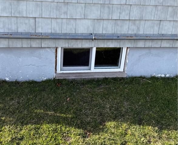 Our Sunhouse Window Enclosures Help Waterproof a Basement in Warwick, RI - Before Photo