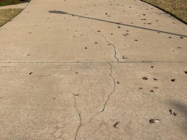 Driveway Lift and Crack Repair Restored Safety and Stability in Sherwood, AR - Before Photo