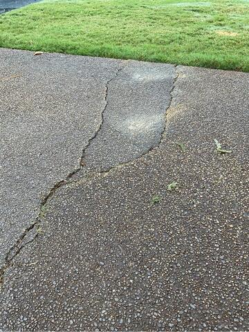 Concrete Leveling and Crack Repair for Driveway and Patio in Collierville, TN - Before Photo