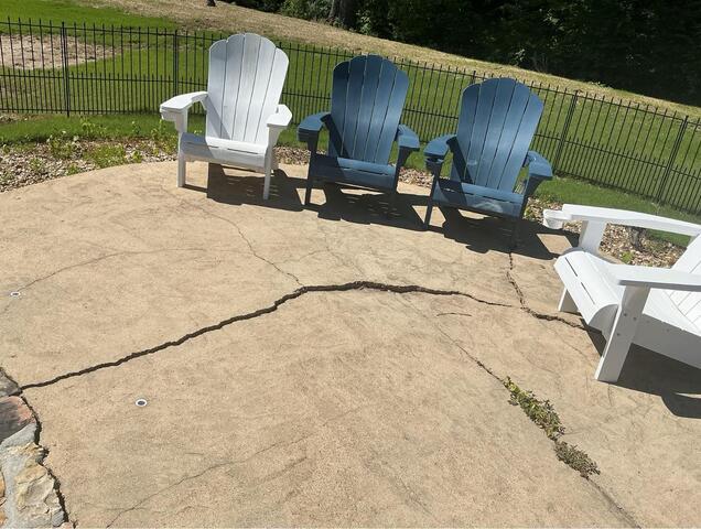 Arlington, TN Pool Deck Concrete Lifting Restored Safety Around a Settled Patio Slab - Before Photo