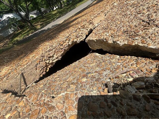 Driveway Void Repair and Concrete Leveling in Memphis, TN Restored Safe Vehicle Access - Before Photo