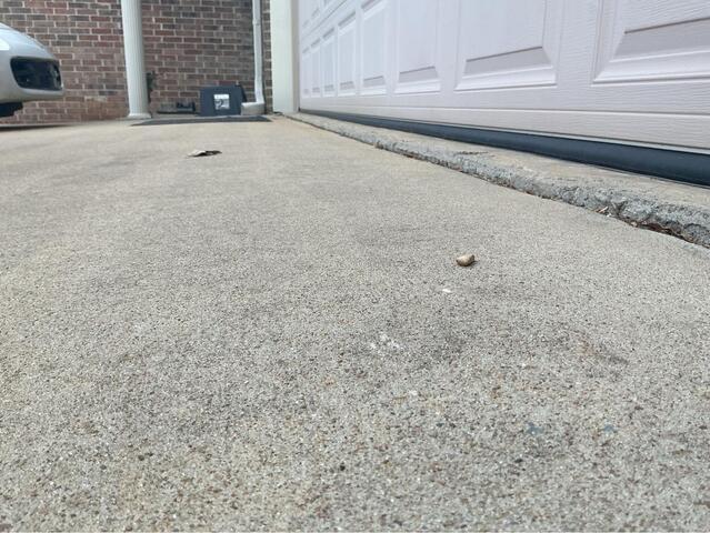 Conway, AR Driveway Repair: Sunken Concrete Lifted, Stabilized, and Sealed - Before Photo