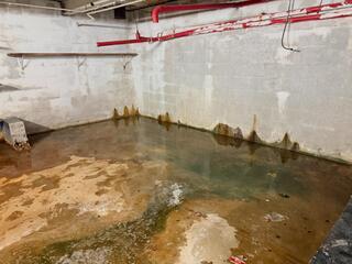 Basement Waterproofing for a Former Jiffy Lube Turned Title Max
