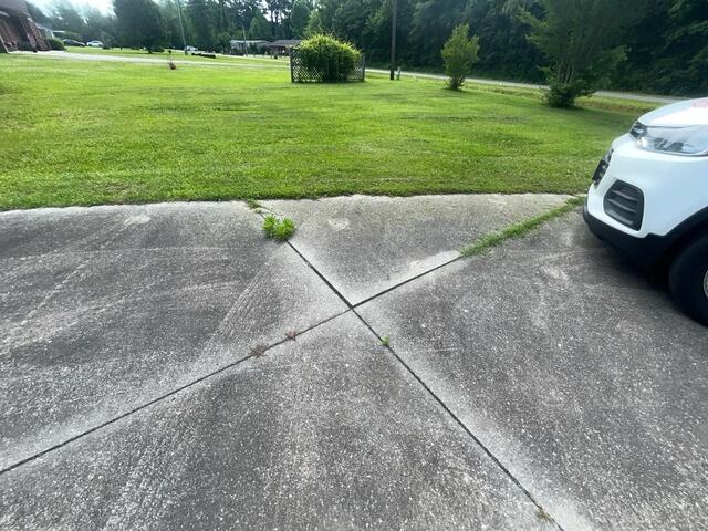 Soil Erosion Damages Concrete Slab in Teachey, NC - Before Photo