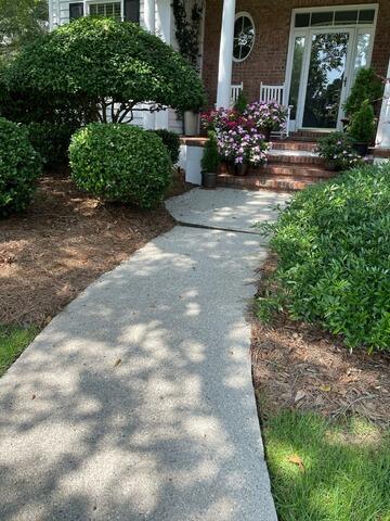 Restoring Safety: Leveling a Sinking Sidewalk in Wilmington, NC - Before Photo