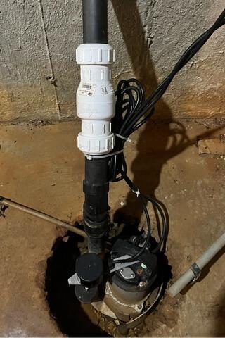 Sump Pump Replacement and Basement Waterproofing in Essex, Vermont, by Matt Clark's Northern Basement Systems. - Before Photo