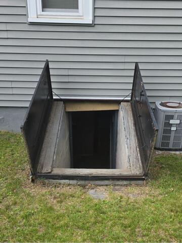 Replacing a Bulkhead Door in Chicopee, MA - Before Photo