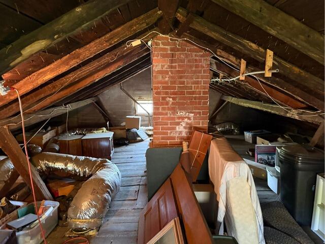 Insulating an Attic Using our SuperAttic™ System in Bristol, CT - Before Photo
