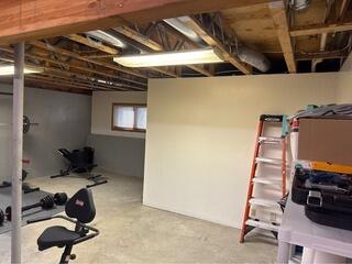 Installing RockWool Batting in the Ceiling of a Basement in Stockbridge, MA