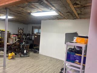 Installing RockWool Batting in the Ceiling of a Basement in Stockbridge, MA