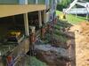Settling Foundation Repair with Piers in Hillsboro, Ohio