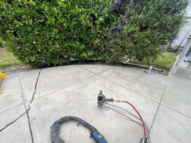 How Saber Became the Best Option for Lifting a Sinking Concrete Patio: A Real Fix from One of Long Beach's Top Concrete Leveling Companies - Before Photo