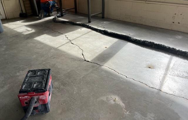 Concrete Crack Stitching Restores Garage Floor in San Diego, CA - Before Photo