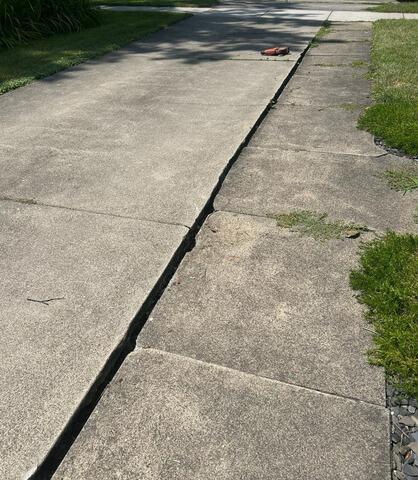 Sinking Concrete Repair in Webster, NY - Before Photo