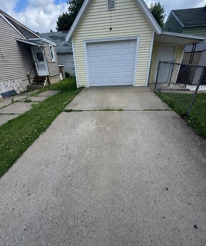 Sinking Driveway Repair in Utica, NY - Before Photo