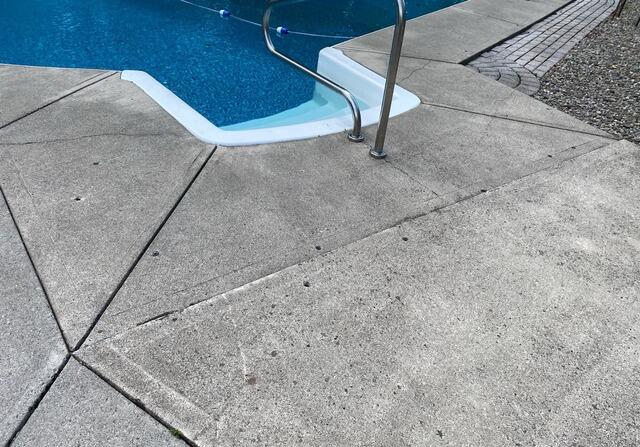 Pool Deck Crack Repair in Cicero, NY - Before Photo