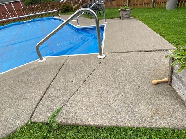 Cracked Pool Deck Repair in DeRuyter, NY - Before Photo