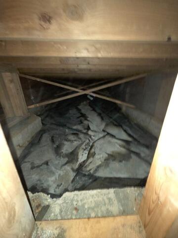 Nasty Moldy Crawl Space Liner in Anchorage, AK - Before Photo