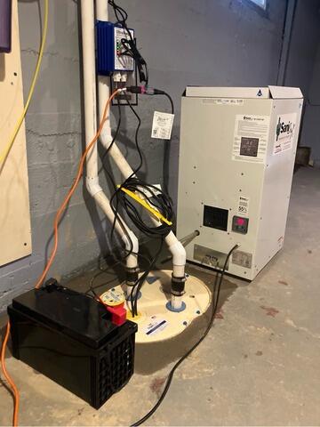 Installing a Sump Pump and Drainage System to Basement in Manchester, NH