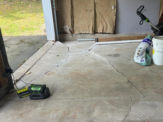 Cracked Garage Floor Repair in Andover, MA - Before Photo