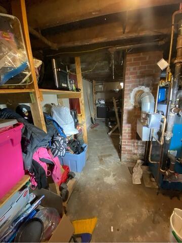 Wet Basement Floor Repair in Manchester, NH - Before Photo