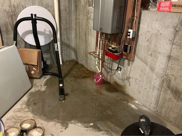 Water Pooling in Basement Solutions in Framingham, MA - Before Photo