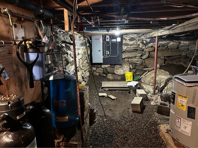 Fieldstone Wall Repair in Northwood, NH - Before Photo