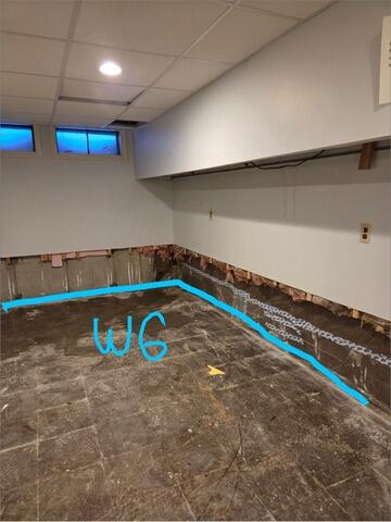 Wet Finished Basement Solutions in Bedford, NH - Before Photo
