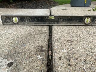 Removing Trip Hazards on Concrete Walkway in Raynham, MA