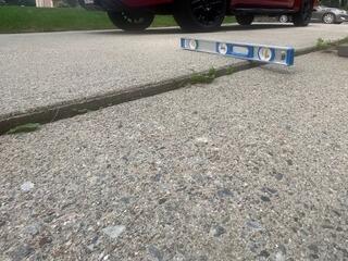 Removing Trip Hazards on Concrete Walkway in Raynham, MA