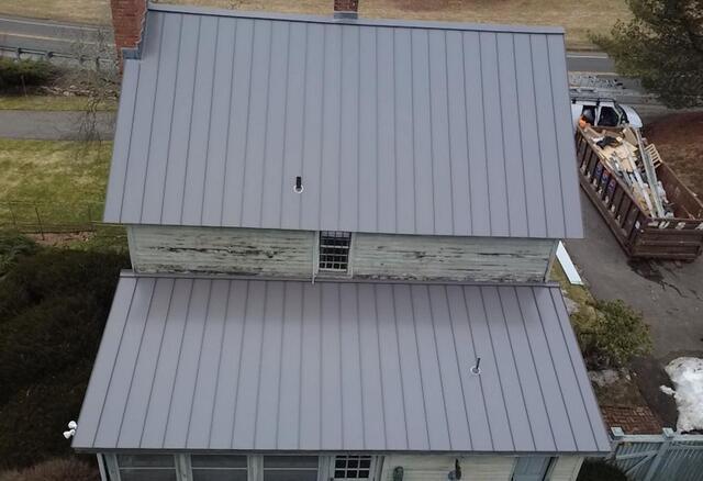 Most Covered Roof Replaced By Standing Seam Metal Roofing - After Photo