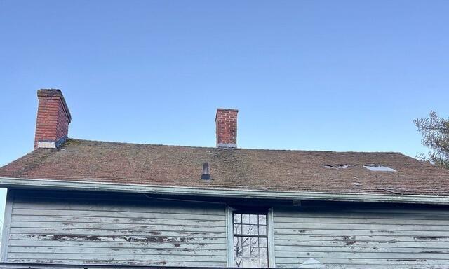 Most Covered Roof Replaced By Standing Seam Metal Roofing - Before Photo