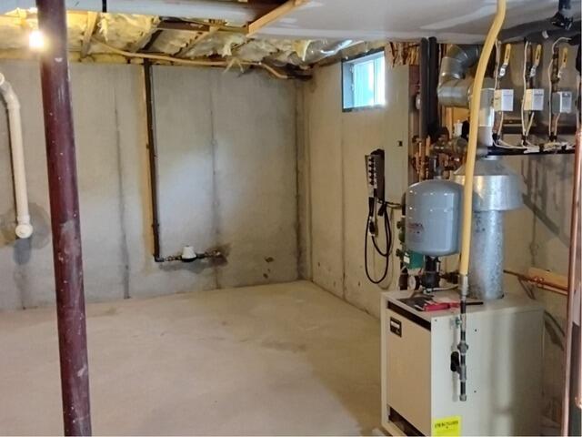 Installing a Full Basement Waterproofing System in Saugerties, NY - Before Photo