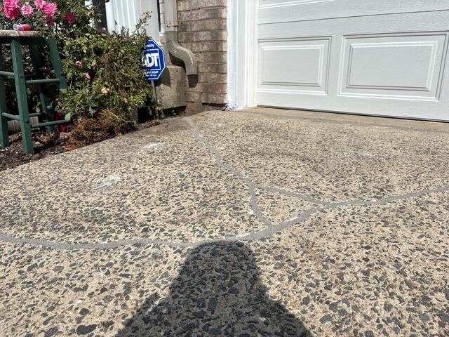 Settling Concrete Driveway Lifted and Restored in Ashburn,VA