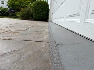 Leveled stamped concrete driveway in Centreville, VA
