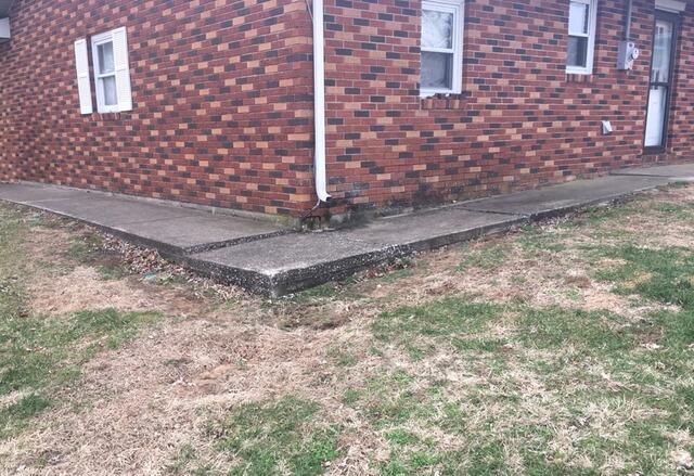 Concrete Sidewalk Leveling in Lyons, IN - Before Photo