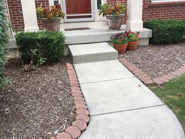 Front Walkway Concrete Lifting in Oldenburg - Before Photo