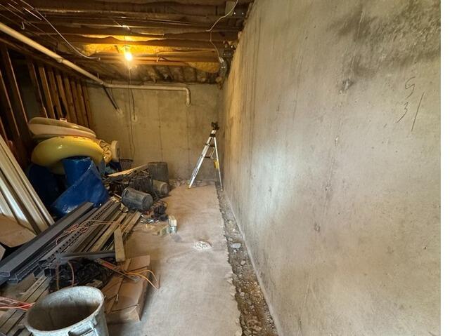 Basement Drainage System Installation in Larwill - Before Photo