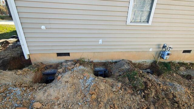Helical Pier Installation to Correct Foundation Settlement - Durham, NC - Before Photo