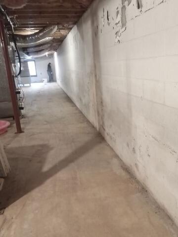 Basement Water Intrusion Addressed with Interior Waterproofing System | Mocksville, NC - Before Photo