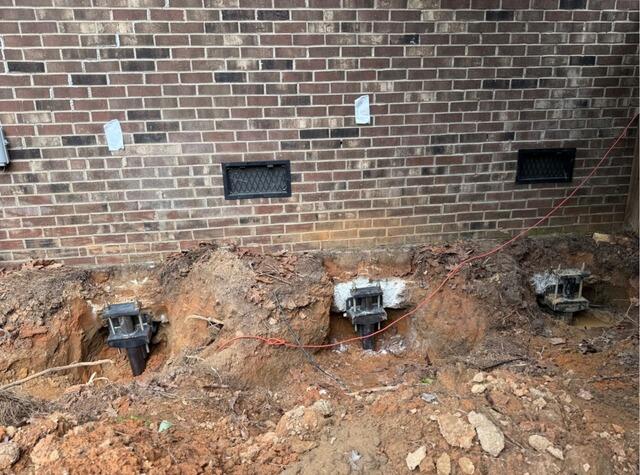 Helical Pier Installation Stabilizes Settling Foundation in Greensboro, NC - Before Photo