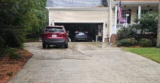 Uneven & Cracked Driveway Restored with PolyLevel in Apex, NC