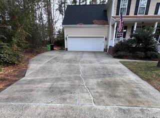 Uneven & Cracked Driveway Restored with PolyLevel in Apex, NC
