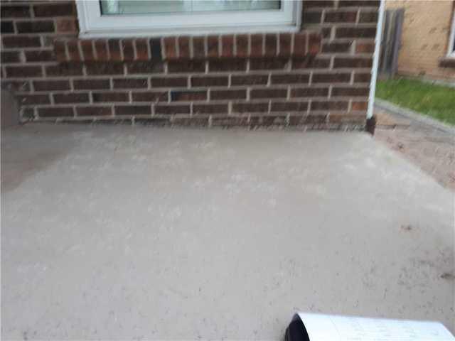 Slanted Patio & Trip Hazard Repair in Mississauga, Ontario` - Before Photo